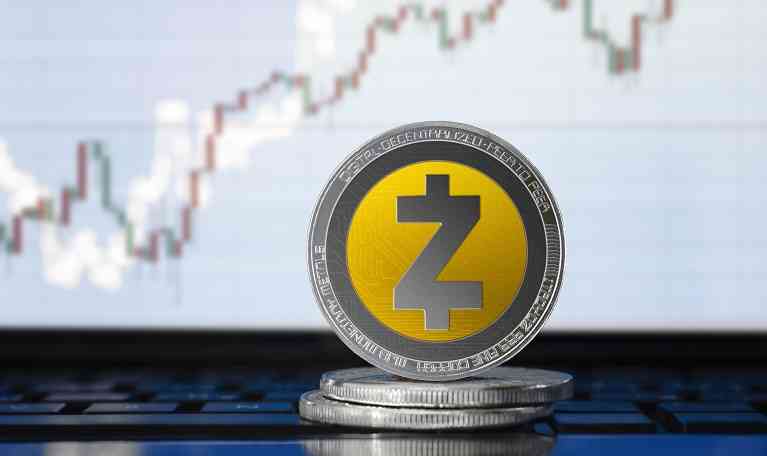 Zcash (ZEC) cryptocurrency; physical concept Zcash coin on the background of the chart