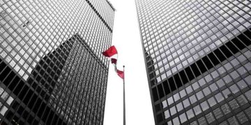 Canadian flag and skyscrapers