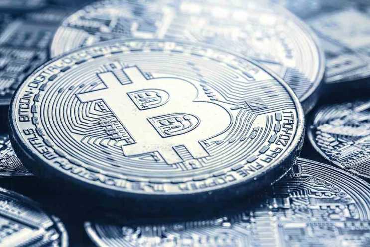 Bitcoin. Golden and silver bitcoins - virtual cryptocurrency.